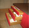 red sliding drawers kitchen design leeds